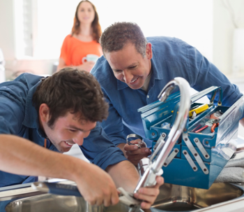 Plumber fixing a pipe