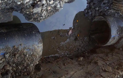 Professional plumber performing emergency sewer repair near Huntington Beach, CA.