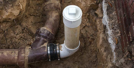 Plumber performing sewer line repair in Huntington Beach, using video inspection technology to identify issues in underground pipes.