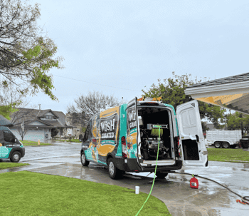 Commercial hydro jetting machine inside Wish Granted plumbing van, used for clearing heavy buildup and recurring drain clogs in commercial plumbing systems across Huntington Beach.