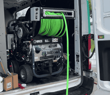 Hydro jetting machine inside Wish Granted service van used for clearing stubborn drain clogs and heavy pipe buildup in Huntington Beach homes.